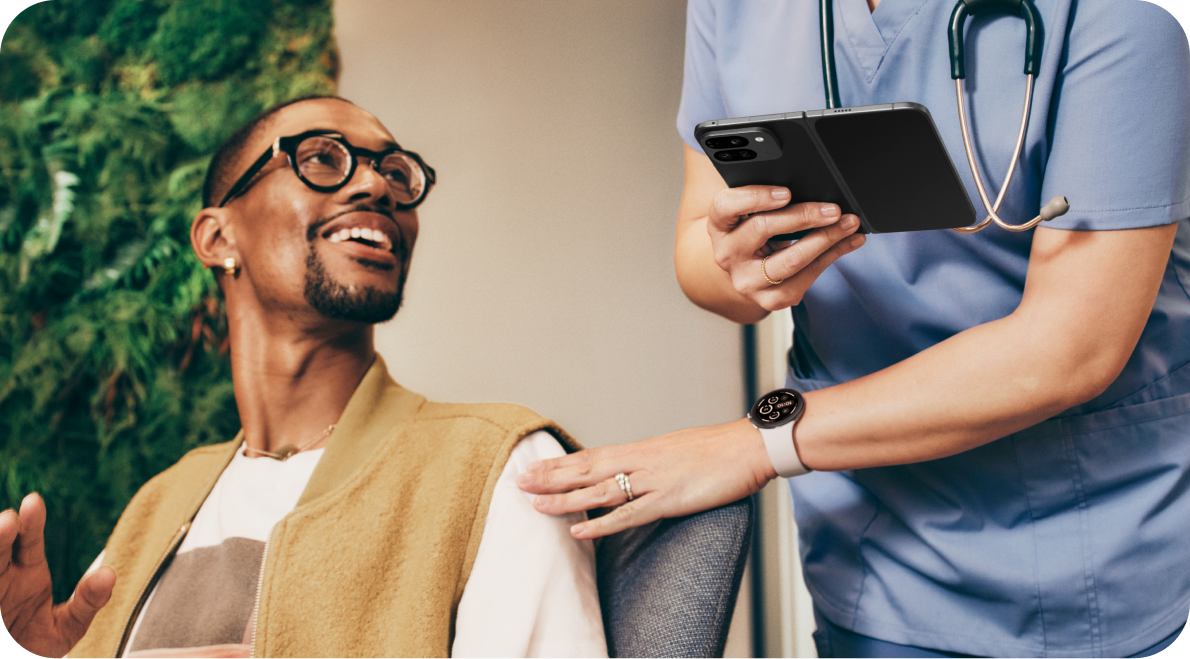 A doctor showing a patient information on her Pixel 9 Pro Fold.