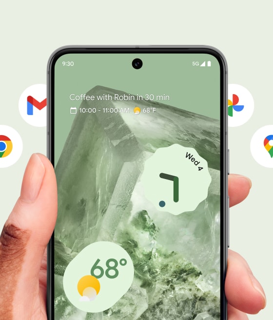 A Pixel phone in front of a carousel of Google app icons.
